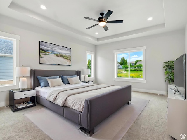 1016 W Mountain Orchard Dr, Pleasant View, UT 84414 - bedroom with a raised ceiling, light colored carpet, multiple windows, and recessed lighting