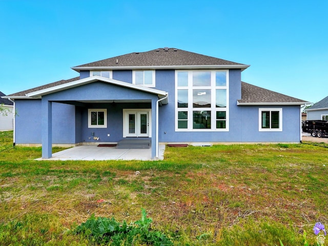 1016 W Mountain Orchard Dr, Pleasant View, UT 84414 - rear view of property featuring a patio area, a lawn, stucco siding, and roof with shingles