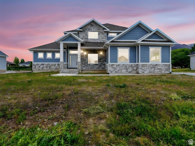 1016 W Mountain Orchard Dr, Pleasant View, UT 84414 - view of front of home with stone siding and a front lawn