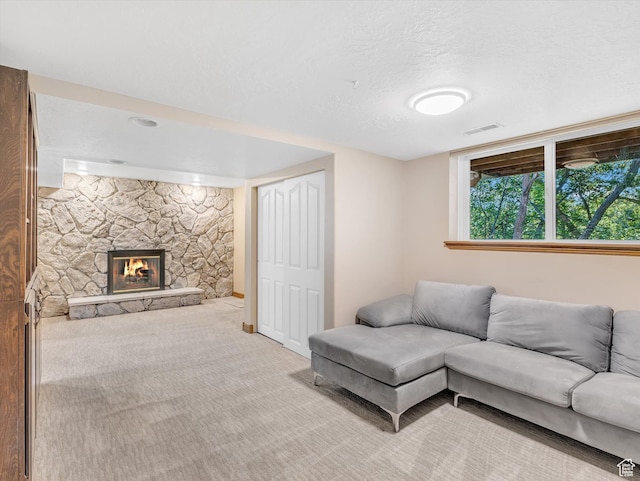 3351 E Deer Hollow Cir S, Sandy, UT 84092 - living area featuring light colored carpet, a stone fireplace, and a textured ceiling