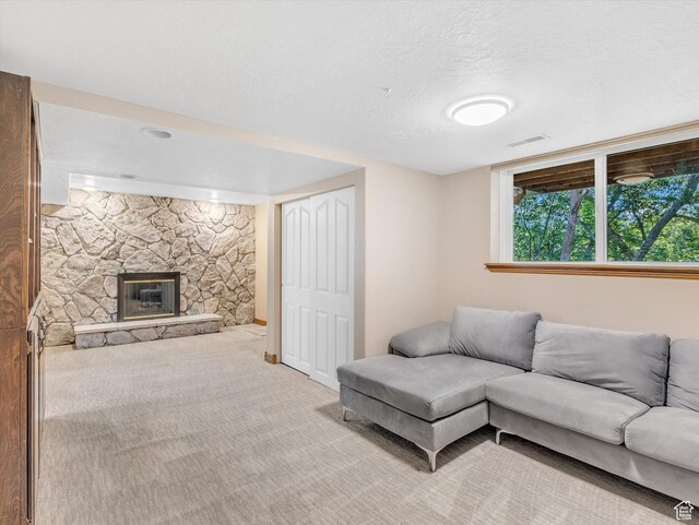 3351 E Deer Hollow Cir S, Sandy, UT 84092 - living area with light colored carpet, a fireplace, and a textured ceiling