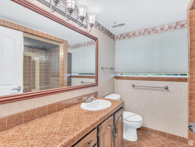 3351 E Deer Hollow Cir S, Sandy, UT 84092 - full bath with toilet, vanity, tiled shower, wallpapered walls, and tile patterned flooring