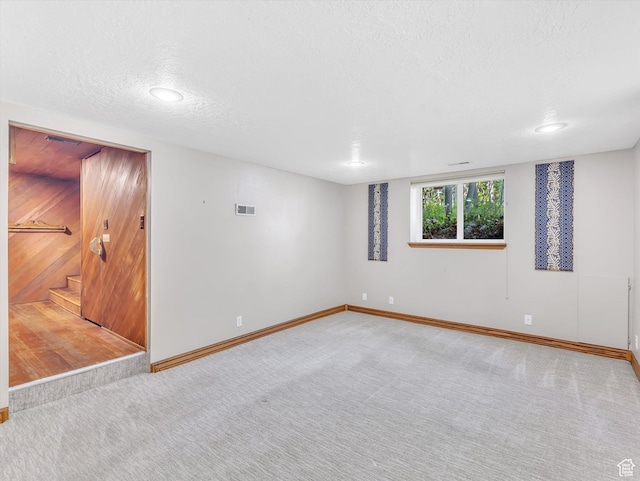 3351 E Deer Hollow Cir S, Sandy, UT 84092 - unfurnished room featuring carpet floors, baseboards, a textured ceiling, and stairs