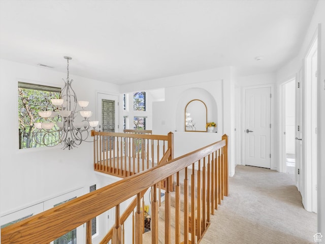 3351 E Deer Hollow Cir S, Sandy, UT 84092 - hallway featuring an upstairs landing, a chandelier, and light colored carpet
