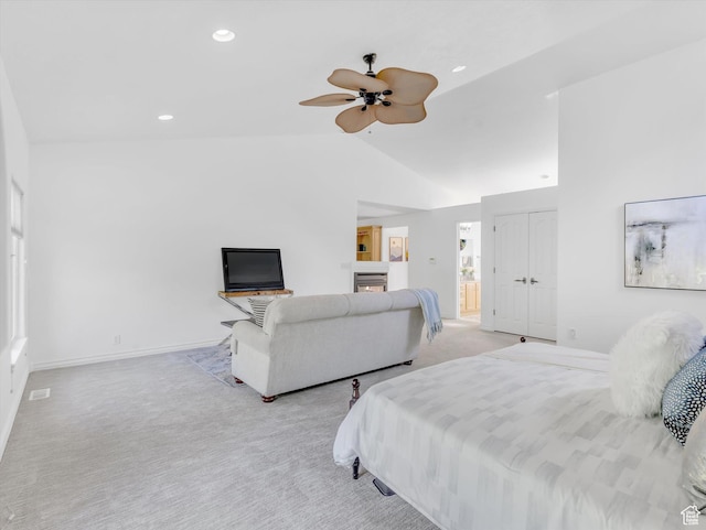 3351 E Deer Hollow Cir S, Sandy, UT 84092 - bedroom with light colored carpet, lofted ceiling, recessed lighting, a glass covered fireplace, and baseboards