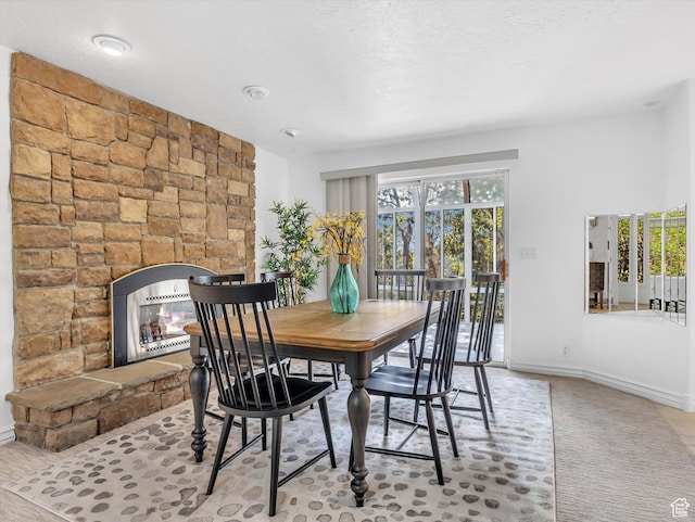 3351 E Deer Hollow Cir S, Sandy, UT 84092 - dining room featuring a stone fireplace and baseboards