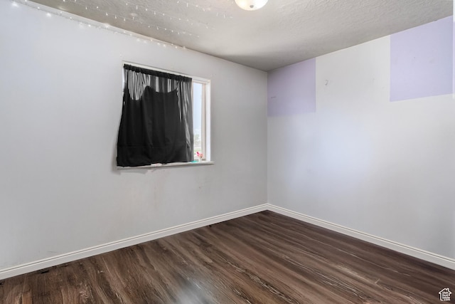 544 E 1875 S, Roosevelt, UT 84066 - unfurnished room featuring wood finished floors, baseboards, and a textured ceiling
