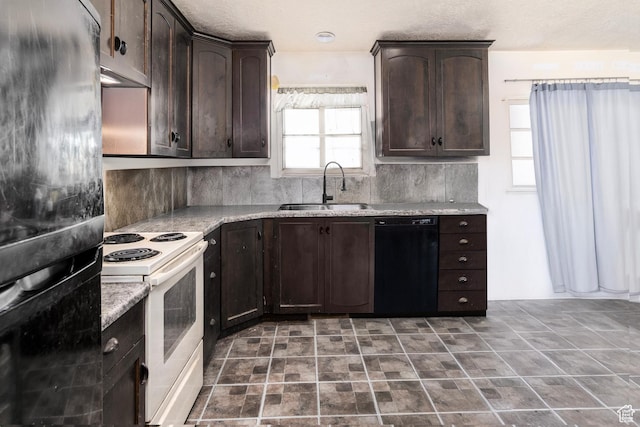 544 E 1875 S, Roosevelt, UT 84066 - kitchen featuring a sink, black appliances, dark brown cabinetry, backsplash, and light stone countertops