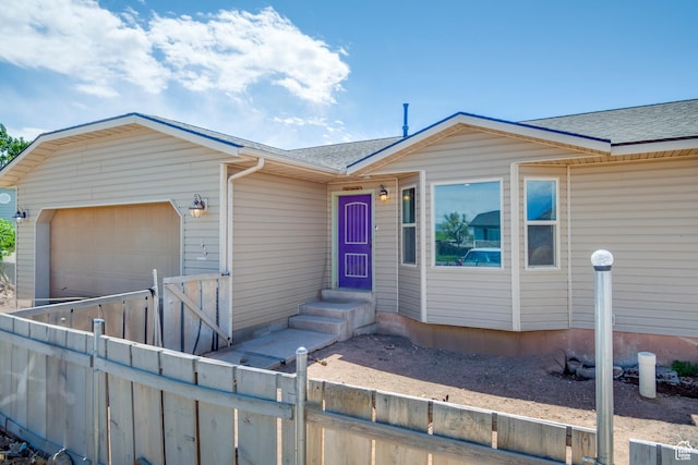 544 E 1875 S, Roosevelt, UT 84066 - view of front of home featuring an attached garage, a shingled roof, driveway, and a gate
