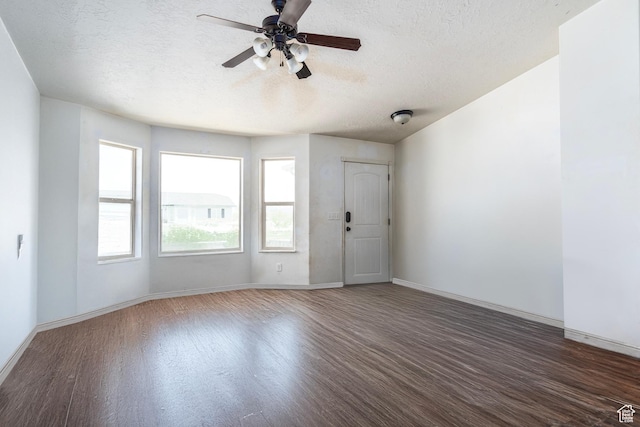 544 E 1875 S, Roosevelt, UT 84066 - unfurnished room featuring wood finished floors, a textured ceiling, a ceiling fan, and baseboards