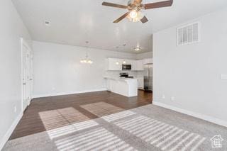 303 W 435 N, Vineyard, UT 84059 - unfurnished living room featuring baseboards, ceiling fan, and a chandelier