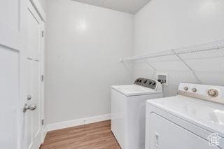 303 W 435 N, Vineyard, UT 84059 - laundry room with washer and dryer, baseboards, and light wood finished floors
