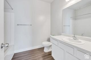 303 W 435 N, Vineyard, UT 84059 - full bathroom featuring toilet, vanity, baseboards, wood finished floors, and shower / bath combination