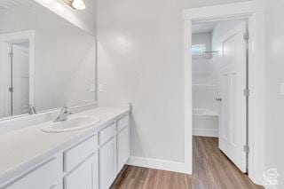 303 W 435 N, Vineyard, UT 84059 - bathroom featuring wood finished floors, vanity, and baseboards