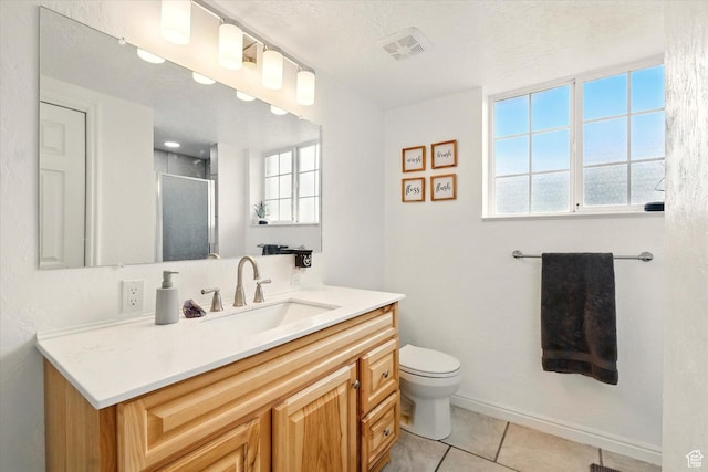 211 S 300 E, Wellsville, UT 84339 - full bath with a shower stall, tile patterned floors, vanity, and toilet