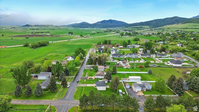 211 S 300 E, Wellsville, UT 84339 - aerial overview of property's location featuring a mountain backdrop and rural landscape