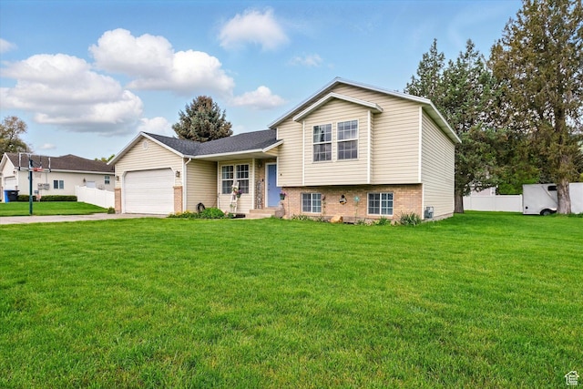 211 S 300 E, Wellsville, UT 84339 - tri-level home featuring driveway, a garage, and brick siding
