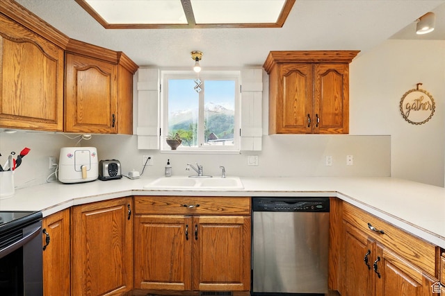 211 S 300 E, Wellsville, UT 84339 - kitchen with dishwasher, a sink, brown cabinets, and light countertops