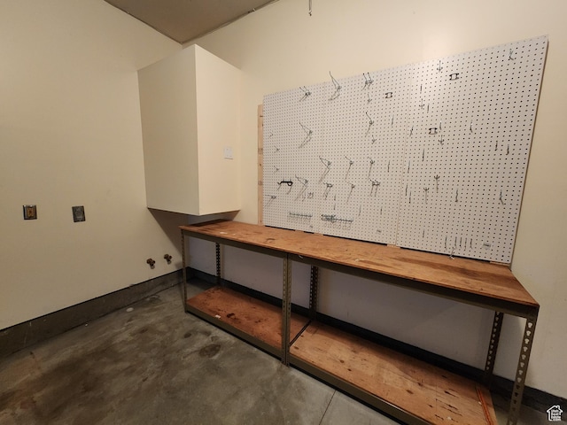 interior space featuring concrete floors and a workshop area