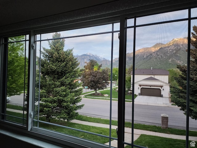 doorway with a mountain view and plenty of natural light