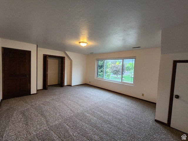 unfurnished bedroom with carpet flooring and baseboards