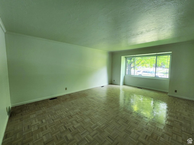 11258 S Brandon Park Dr E, Sandy, UT 84092 - unfurnished room with baseboards, a textured ceiling, and crown molding