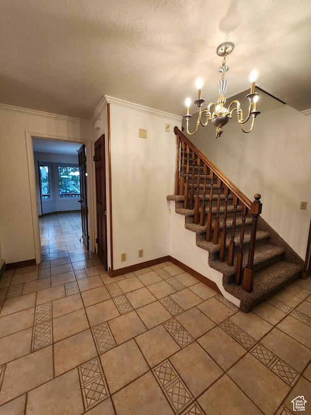 stairway with ornamental molding, a chandelier, and baseboards