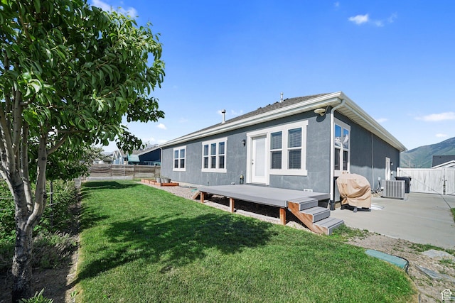 607 N 1980 E Unit 139, Spanish Fork, UT 84660 - rear view of property featuring central AC unit, a gate, and a wooden deck