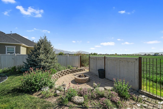 607 N 1980 E Unit 139, Spanish Fork, UT 84660 - fenced backyard featuring a fire pit, a mountain view, and a patio