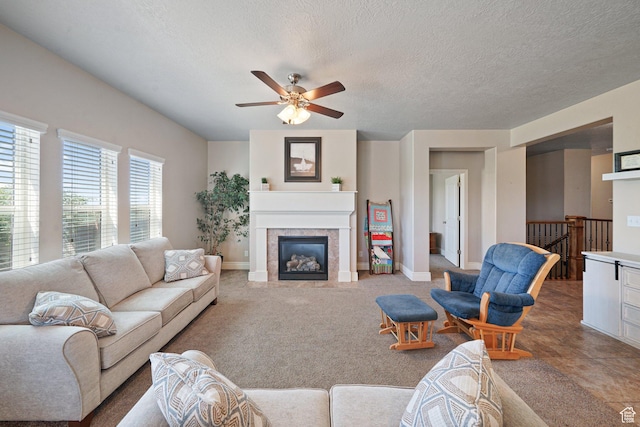 607 N 1980 E Unit 139, Spanish Fork, UT 84660 - living room featuring a ceiling fan, baseboards, a glass covered fireplace, and a textured ceiling