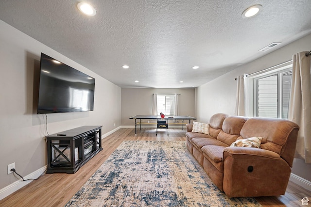 607 N 1980 E Unit 139, Spanish Fork, UT 84660 - living area featuring a textured ceiling, baseboards, light wood-style flooring, and recessed lighting