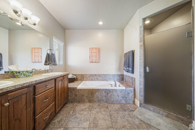 607 N 1980 E Unit 139, Spanish Fork, UT 84660 - bathroom featuring a garden tub, double vanity, and a shower stall