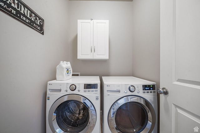 607 N 1980 E Unit 139, Spanish Fork, UT 84660 - clothes washing area with washer and dryer and cabinet space