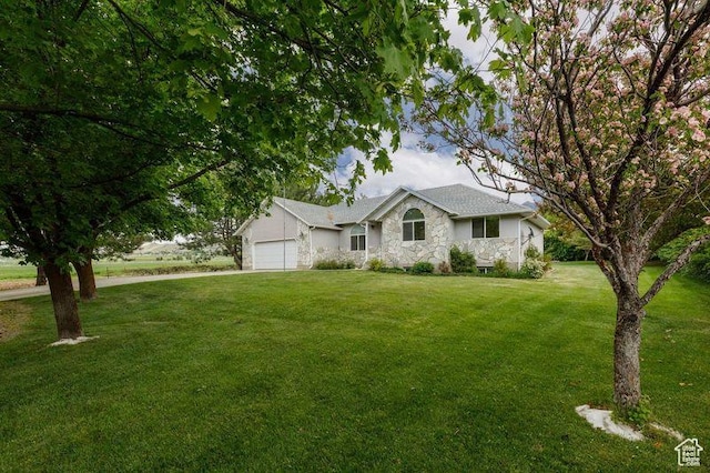 540 N 100 E, Hyde Park, UT 84318 - ranch-style home featuring a garage, a front yard, stone siding, and driveway