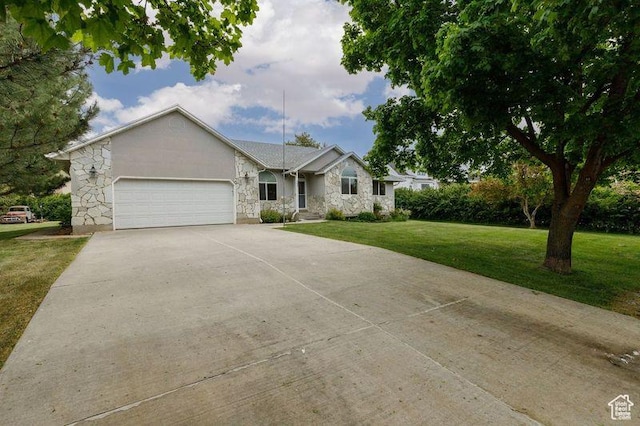 540 N 100 E, Hyde Park, UT 84318 - single story home featuring stone siding, a garage, driveway, and a front lawn