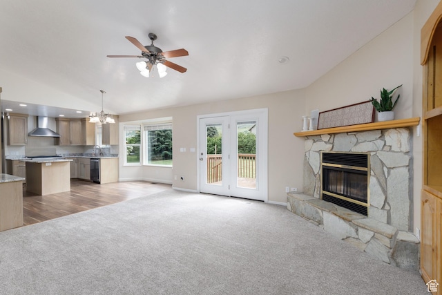 540 N 100 E, Hyde Park, UT 84318 - unfurnished living room with light colored carpet, a chandelier, lofted ceiling, a ceiling fan, and a fireplace