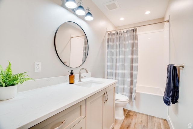 2700 E Red Barn Rd S, Heber City, UT 84032 - bathroom featuring wood finished floors, toilet, vanity, shower / tub combo, and recessed lighting