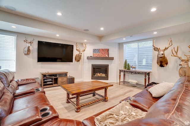 2700 E Red Barn Rd S, Heber City, UT 84032 - living room featuring recessed lighting, a glass covered fireplace, and wood finished floors