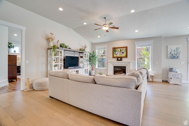 2700 E Red Barn Rd S, Heber City, UT 84032 - living area featuring light wood finished floors, a ceiling fan, a glass covered fireplace, recessed lighting, and baseboards