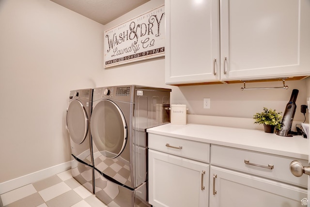 2700 E Red Barn Rd S, Heber City, UT 84032 - clothes washing area with washer and clothes dryer, cabinet space, tile patterned floors, and baseboards