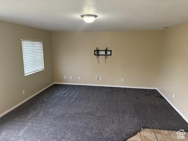 4327 S Westlake W, Roy, UT 84067 - carpeted spare room featuring a textured ceiling and baseboards