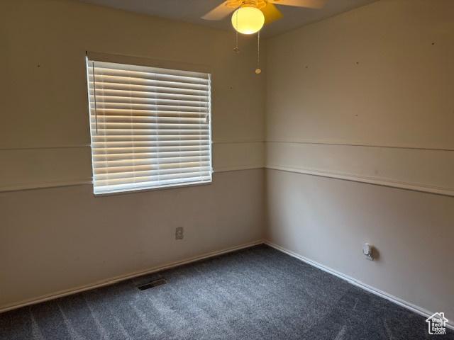 4327 S Westlake W, Roy, UT 84067 - empty room featuring a ceiling fan, dark colored carpet, healthy amount of natural light, and baseboards