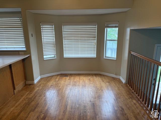 4327 S Westlake W, Roy, UT 84067 - unfurnished dining area with wood finished floors and baseboards