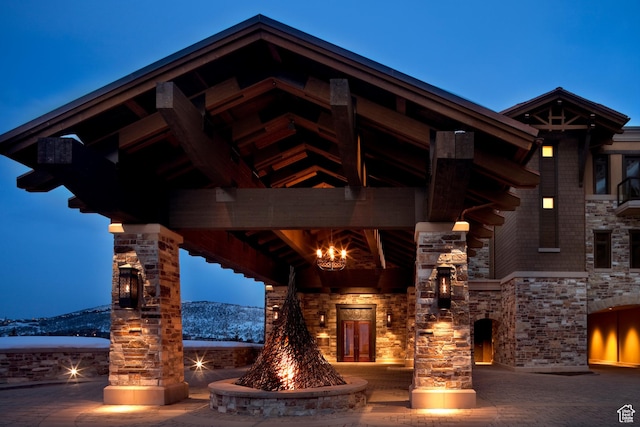 view of building exterior with an outdoor fire pit