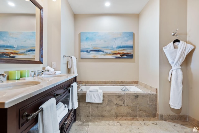 full bath with double vanity, a bath, and recessed lighting