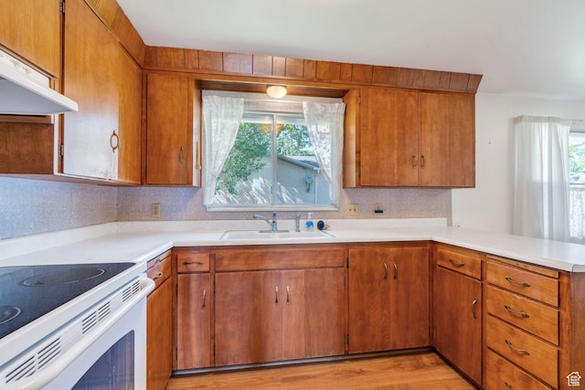 3165 N Bannock Dr E, Provo, UT 84604 - kitchen with under cabinet range hood, healthy amount of natural light, and light countertops