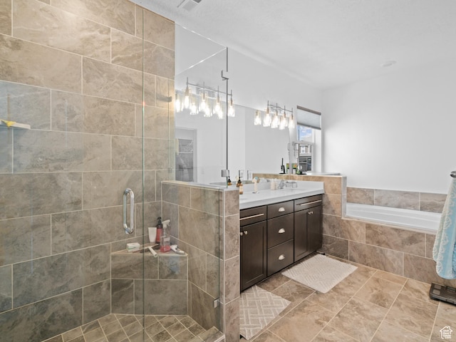 full bathroom with a shower stall, vanity, a bath, and tile patterned flooring