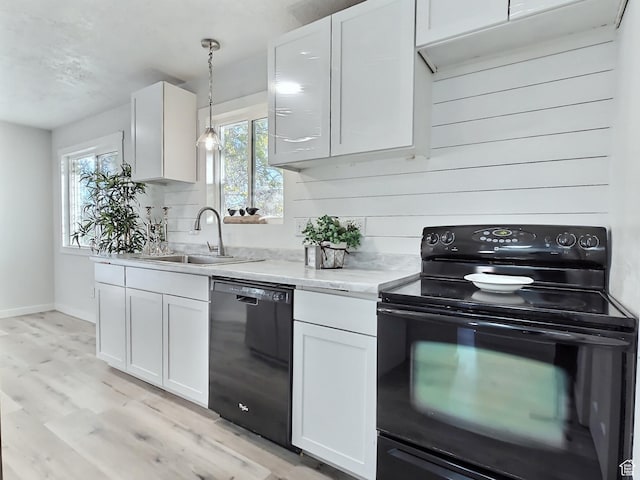 521 N 2400 W, Vernal, UT 84078 - kitchen with black appliances, a sink, and white cabinetry