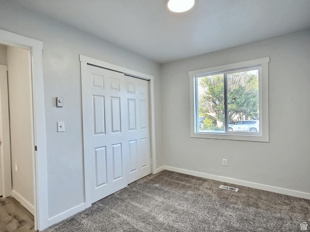 521 N 2400 W, Vernal, UT 84078 - unfurnished bedroom featuring baseboards, carpet floors, and a closet