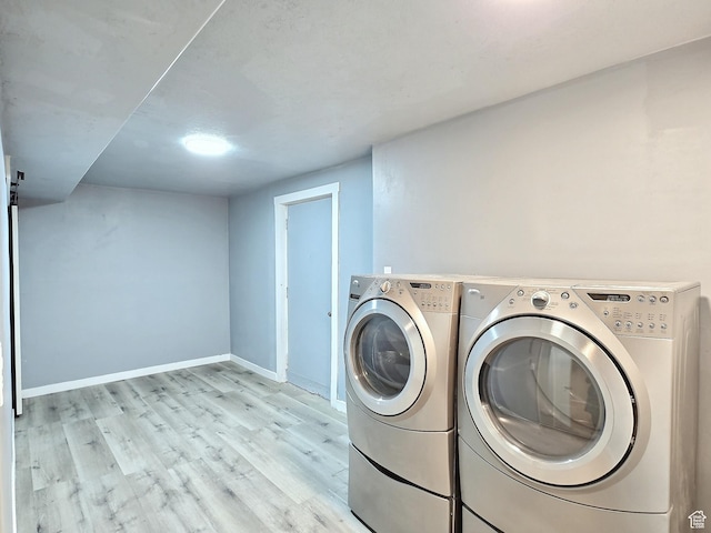 521 N 2400 W, Vernal, UT 84078 - laundry room with washer and dryer, wood finished floors, and baseboards